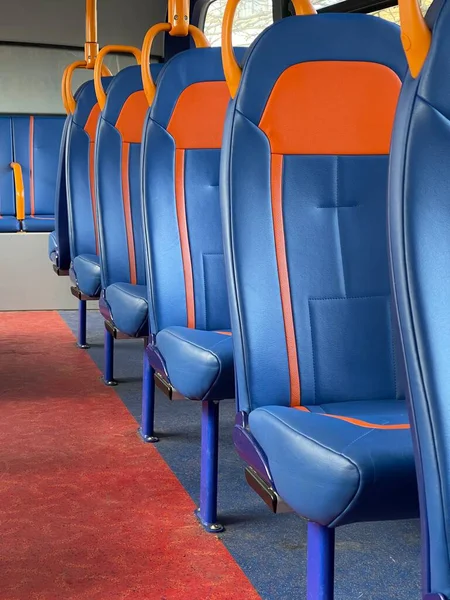 Cropped perspective shot of bus seats on empty coach
