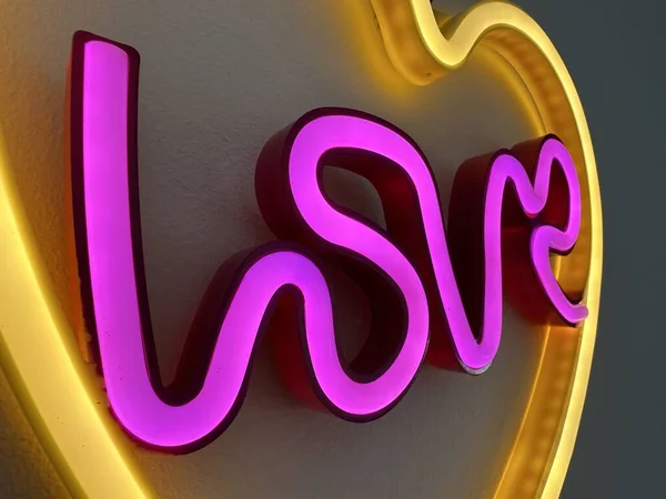 Cropped Close Pink Yellow Love Neon Sign Glowing Dark — Stock Photo, Image