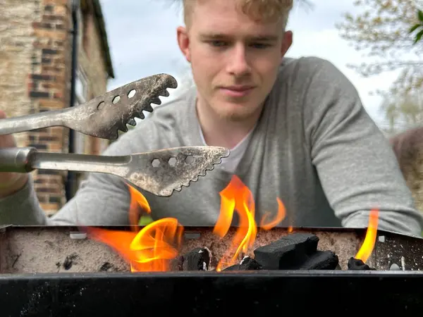 Selective Focus Bbq Grill Fire Handsome Man Smiling Background Holding Stock Picture