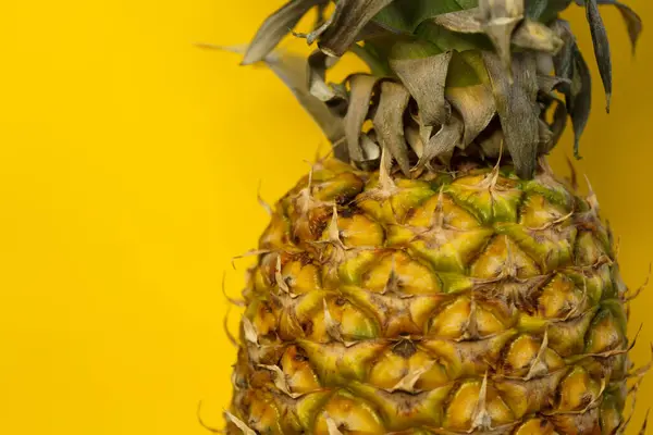 stock image Pineapple on yellow background close up