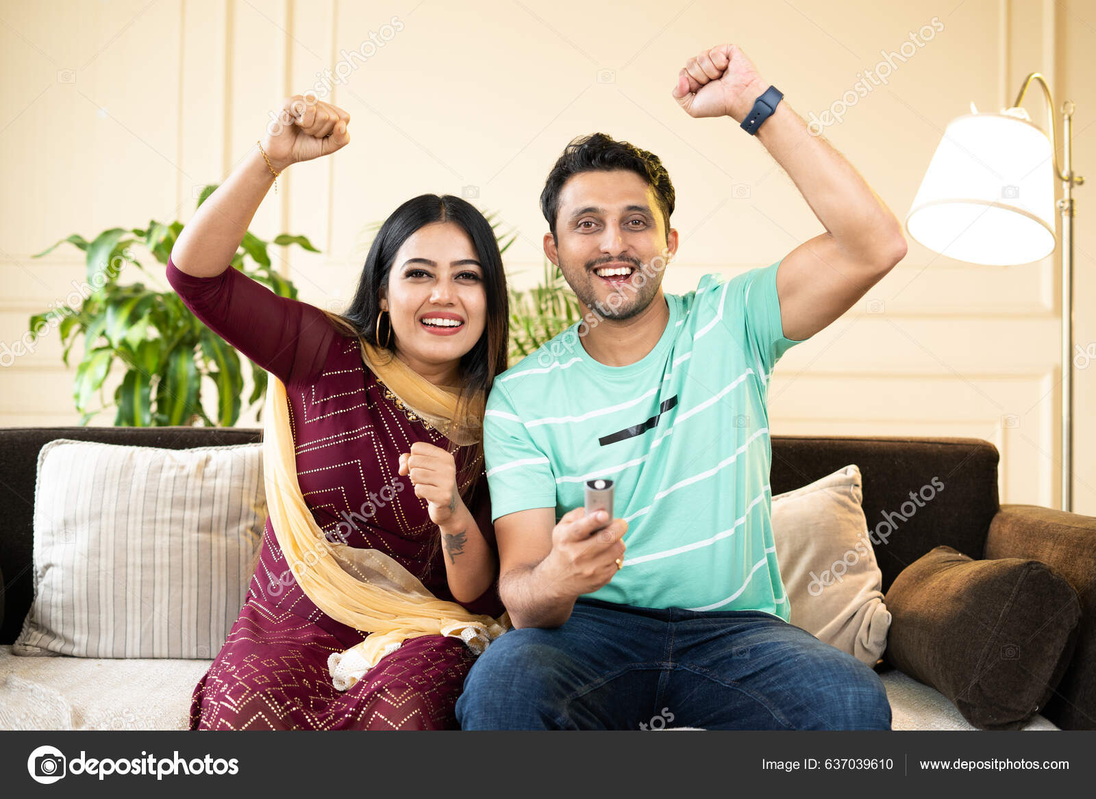 Excited Cheerful Couple Shouting Rising Hands While Watching Live Cricket Stock Photo by ©Lakshmiprasad 637039610