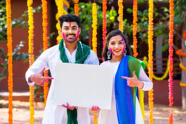 Happy Indian Young Couple Color Face Showing White Empty Board — Stock Photo, Image
