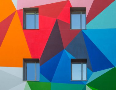 colored facade forming triangles and four windows