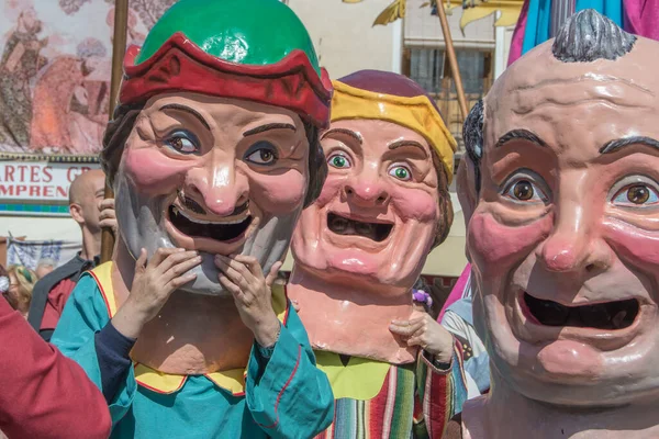 stock image Three big-headed heads parading in a street party