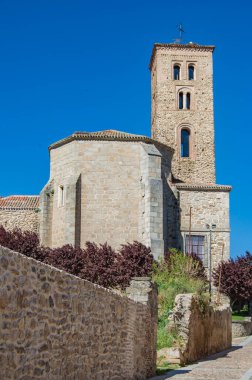 View of the back and medieval tower of the church of Santa Maria del Castillo in Buitrago del Lozoya, province of Madrid. Spain clipart