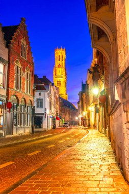 Bruges, Belgium: Belfry of Bruges or Belfort tower street seen from Wollestraat, Europe clipart