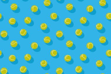 seamless pattern with tennis balls on blue court floor, perfect for stationery, tennis event promotions - vector illustration clipart