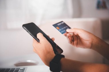 Woman hands holding credit card and smartphone with product purchase at home, Female register via credit cards on mobile phone to make digital payment security online, Internet online shopping concept