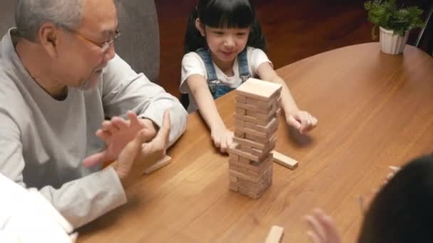 Happy Grandparents Asian Family Enjoy Playing Toy Block Little Daughter — Stock video