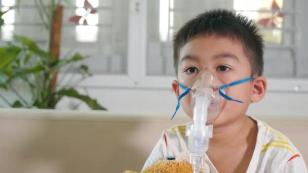 Asian Child Using Nebulizer Mask Equipment Alone Have Smoke Kid — стоковое видео