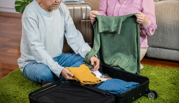 Asian Romantic Retired Couple Packing Clothes Travel Bag Suitcase Together — Stock Photo, Image