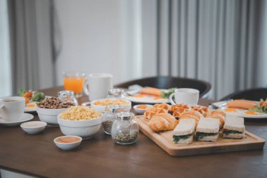Fresh and bright continental breakfast healthy, Breakfast served food with beverage coffee, orange juice on table in the morning at home
