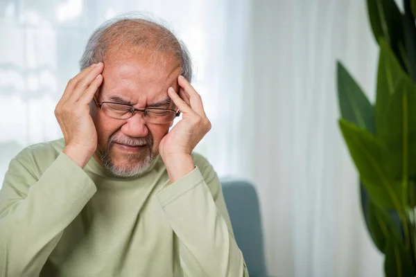 Headache Sad Asian Senior Man Sitting Sofa Feeling Hurt Lonely — Stock Photo, Image
