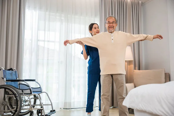 Rehabilitation Disabled People Old Senior Man Enjoys Training Physiotherapist Outstretched — Stockfoto