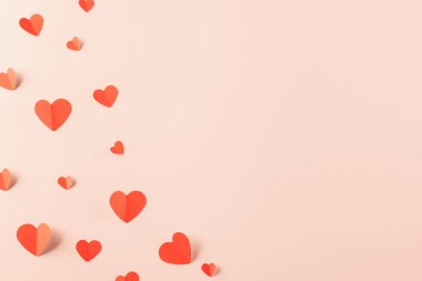 Happy Valentine Day concept, red paper hearts shape cutting isolated pastel pink background, Happy mother day, Symbol of love paper art elements with place for text, Banner design greeting card