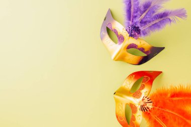 Happy Purim carnival accessories. Carnival mask for Mardi Gras celebration isolated on pastel green background, jewish holiday, Purim in Hebrew holiday carnival ball, Venetian mask