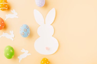 Easter eggs bunny and rabbit white paper cutting isolated on pastel background. Funny decoration, Happy Easter Day, Festive composition banner design holiday background