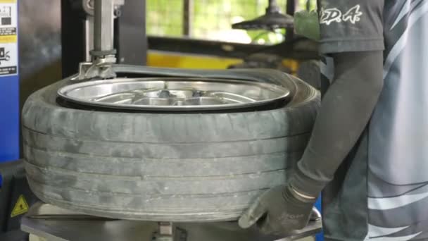 Repairman Replace Tire Auto Removal Mechanic Equipment Loading Automobile Car — Stock Video