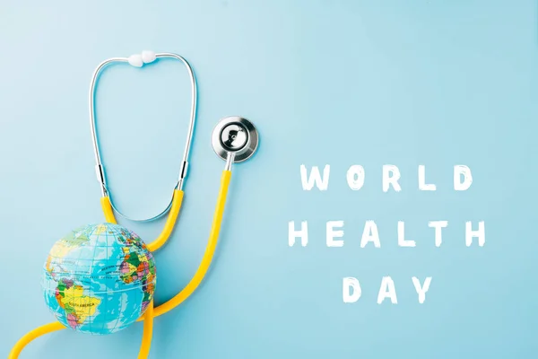 World Health Day Top View Yellow Doctor Stethoscope Wrapped World — Stock fotografie