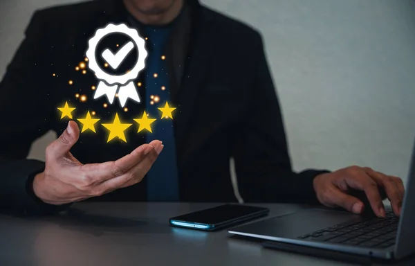 Give your business a boost with positive customer reviews Showcase your service rating with a hand holding five gold stars. Customer service and Satisfaction concept