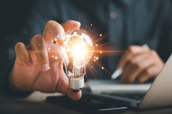 Smart Business Ideas Businessman Protects Glowing Light Bulb Symbolizing Innovation — Stock Photo, Image