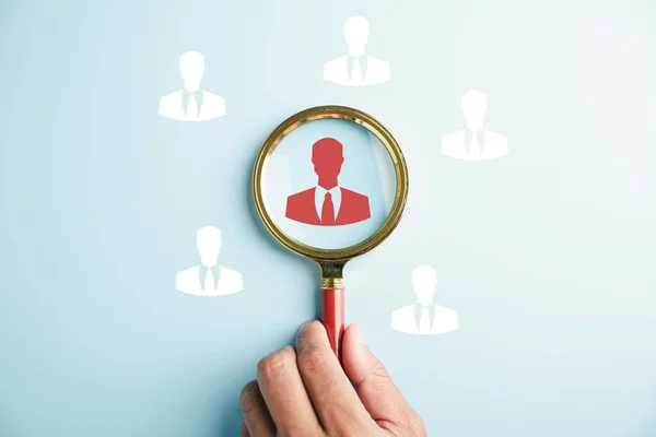 HRM vision Magnifier glass zooms in on manager icon, symbolizing the strategic role of human resource management in human development, recruitment, and leadership. employees selection