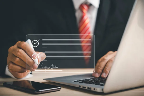 Businessman embraces electronic signature concept, signing electronic documents on virtual screen using stylus pen. Depicts effective business management, technology integration, digital Agreement