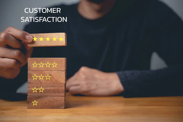 Businessmans Hand Selecting Wooden Block Star Icon Show Excellent Customer — стоковое фото