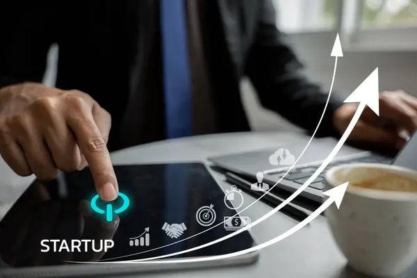 Businessman working on startup plan. Graph chart of business growth on laptop with icon business and network connection on digital interface. Investment and finance strategy for future success