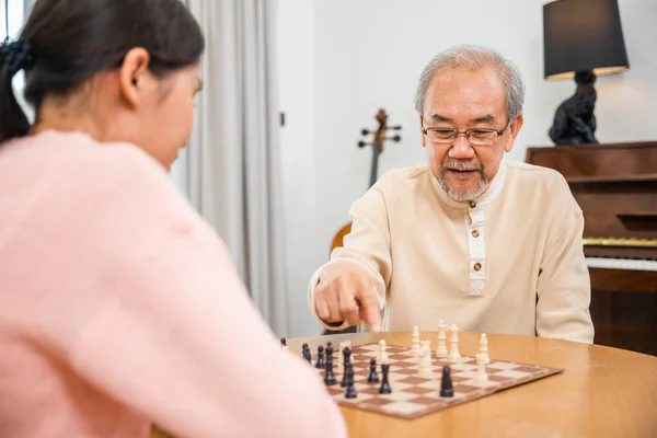Smiling Senior Elderly Having Fun Playing Chess Game Beautiful Daughter — Foto Stock