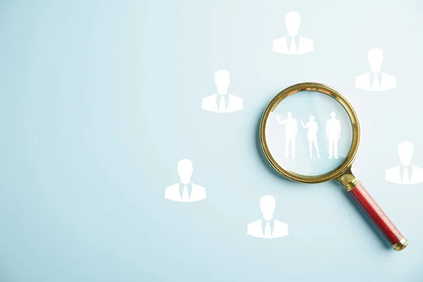 Close-up of a magnifying glass highlighting job search, symbolizing the power of research and discovery in finding employment. Navigating the competitive job market. job search