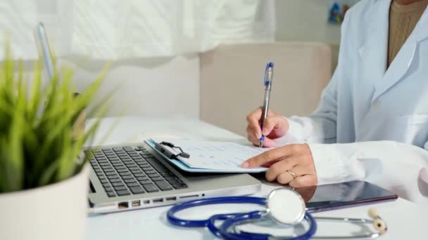 Closeup Doctor Nurse Woman Uniform Stethoscope Writing Information Patient Prescription — Vídeos de Stock