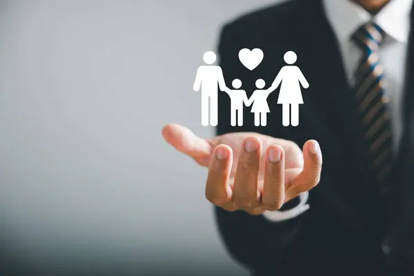 Family centered care, Businessman protective gesture complements young family silhouette. Health and house insurance icon symbolize protection, supporting family support concept. Family life insurance