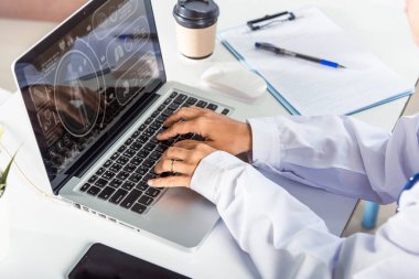 Nurse working using computer browsing internet, Closeup hands female doctor wear uniform in hospital she typing information on keyboard laptop, Healthcare medical health website technology online data