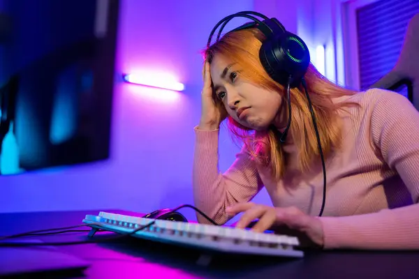 Game losing. Angry Gamer fail plays online video games tournament with computer, Unhappy upset woman wear gaming headphones she lose after playing live stream games online feel depressed at home