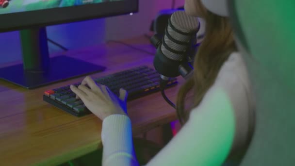Asian Young Gamer Woman Wear Headphones Playing Video Games Online — Vídeo de stock