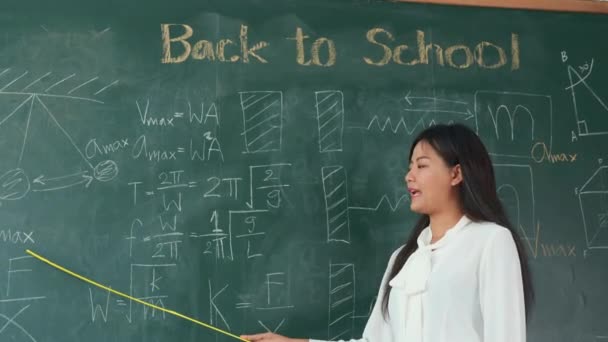 Back School Concept Asian Female Teacher Smiling Wooden Stick Pointing — Vídeo de stock
