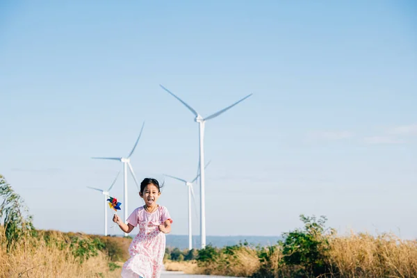 Cheerful Girl Runs Windmills Holding Pinwheels Joy Embracing Playful Wind — Stock Photo, Image