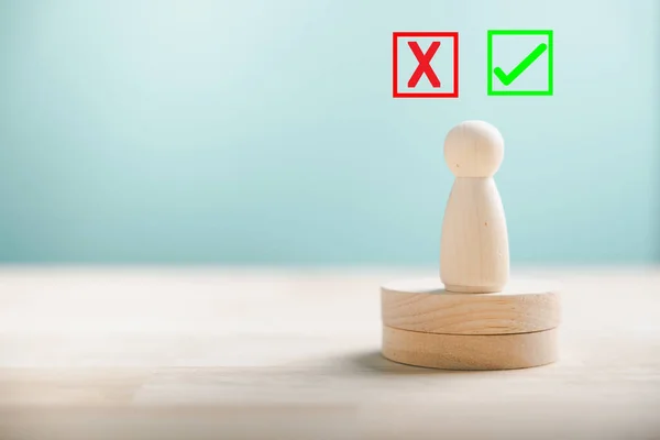 Displaying peoples choices on wooden blocks between right and wrong reflecting yes or no. True and false symbols signify business decision-making. Think With Yes Or No Choice.