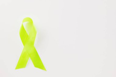 Green awareness ribbon of Gallbladder and Bile Duct Cancer month isolated on white background with copy space, concept of medical and health care support