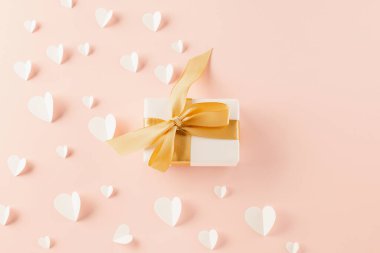 Happy Valentines Day Background. Top view beautiful hearts and gift boxes on pastel pink background surprise your loved with space for text, mothers day, concept banner holiday