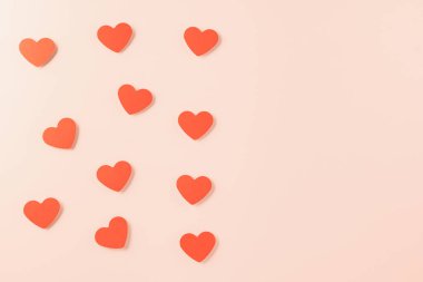 Happy Valentines day concept. Red paper hearts cutting pastel pink background, Symbol of love paper art with copy space for text, Mothers Day