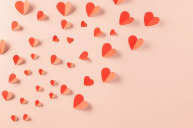 Happy Valentines day concept. Red paper hearts cutting pastel pink background, Symbol of love paper art with copy space for text, Mothers Day