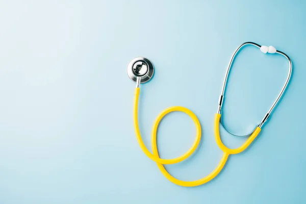 Topv Iew Yellow Medical Stethoscope Isolated Blue Background Copy Space — Stock Photo, Image
