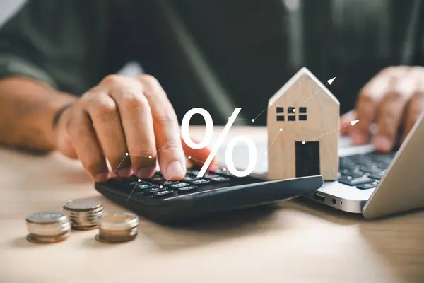 Hand Calculators Strategizing Home Refinance Wooden House Model Buy Rent — Stock Photo, Image