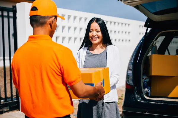Efficient delivery logistics illustrated with a courier handing a cardboard parcel to a smiling woman customer at her home. Emphasizing modern home delivery service and customer happiness.