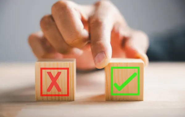 Businessman Finger Touches Two Wooden Cubes Check Marks Depicting Right — Stock Photo, Image