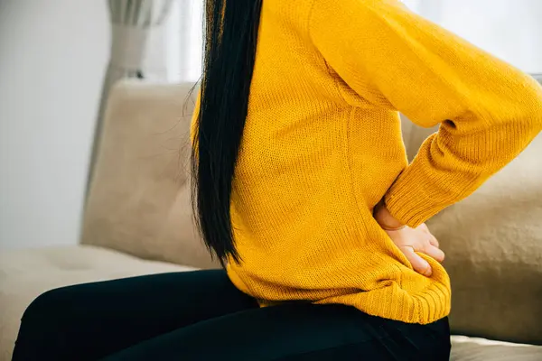 Woman Asia Holds Her Lower Back Unbearable Pain While Seated — Stock Photo, Image