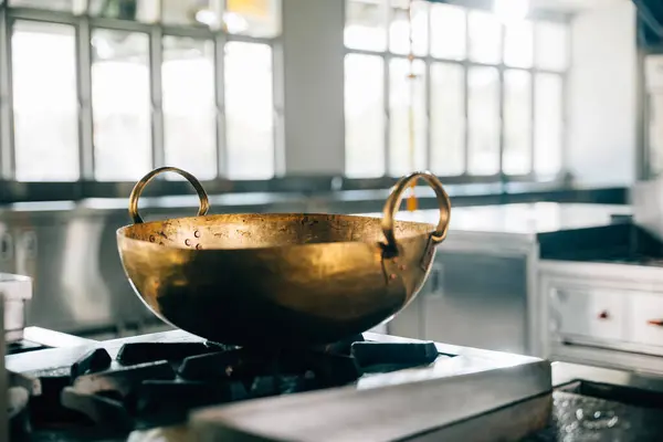 Professional Kitchen Modern Restaurant Features Shiny Metal Bowl Atop Stove Stock Photo