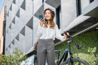 Asian beautiful young woman use smart mobile phone talk with business during go to office work at city street with bicycle, Happy lifestyle business female commuting outside in morning, Eco friendly